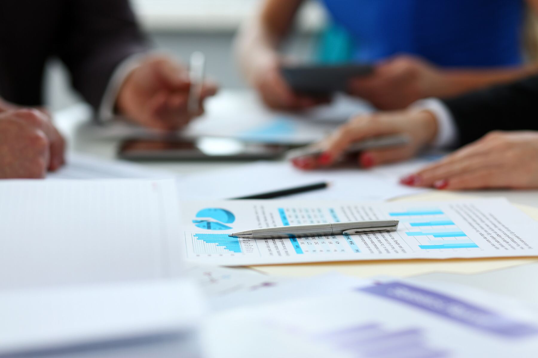 GFI Canada advisors reviewing financial charts and wealth planning documents